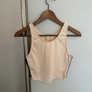 pink tank top with back and white stripes down the side